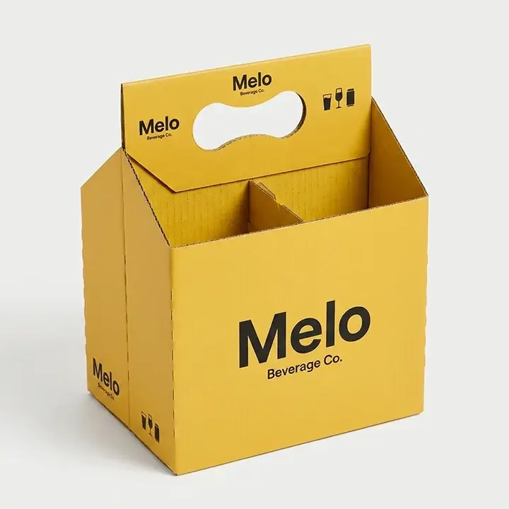 Die-cut cardboard carrier box with integrated handle